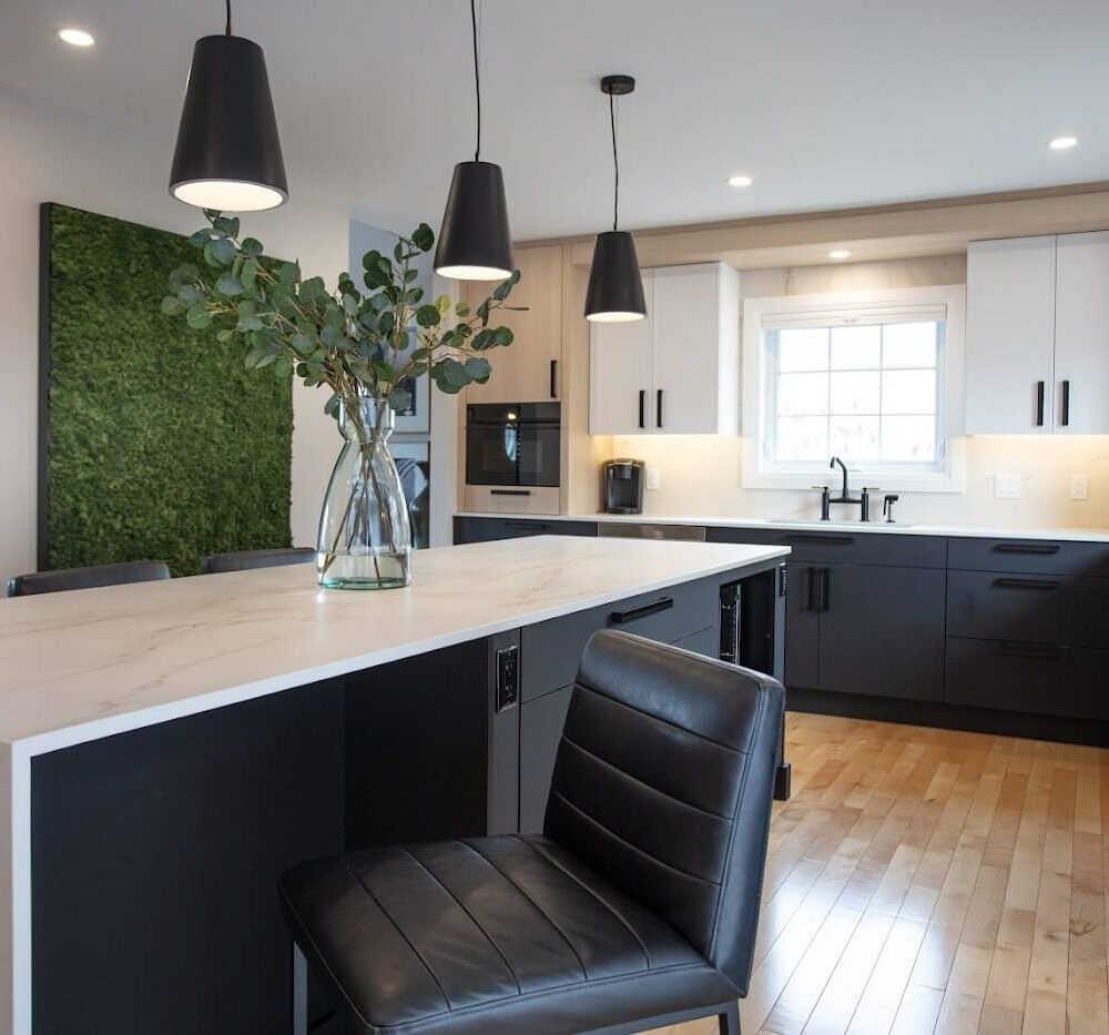 Modern Casey's Kitchens layout with a black island, light wood cabinets, white countertops, and a large window over the sink.