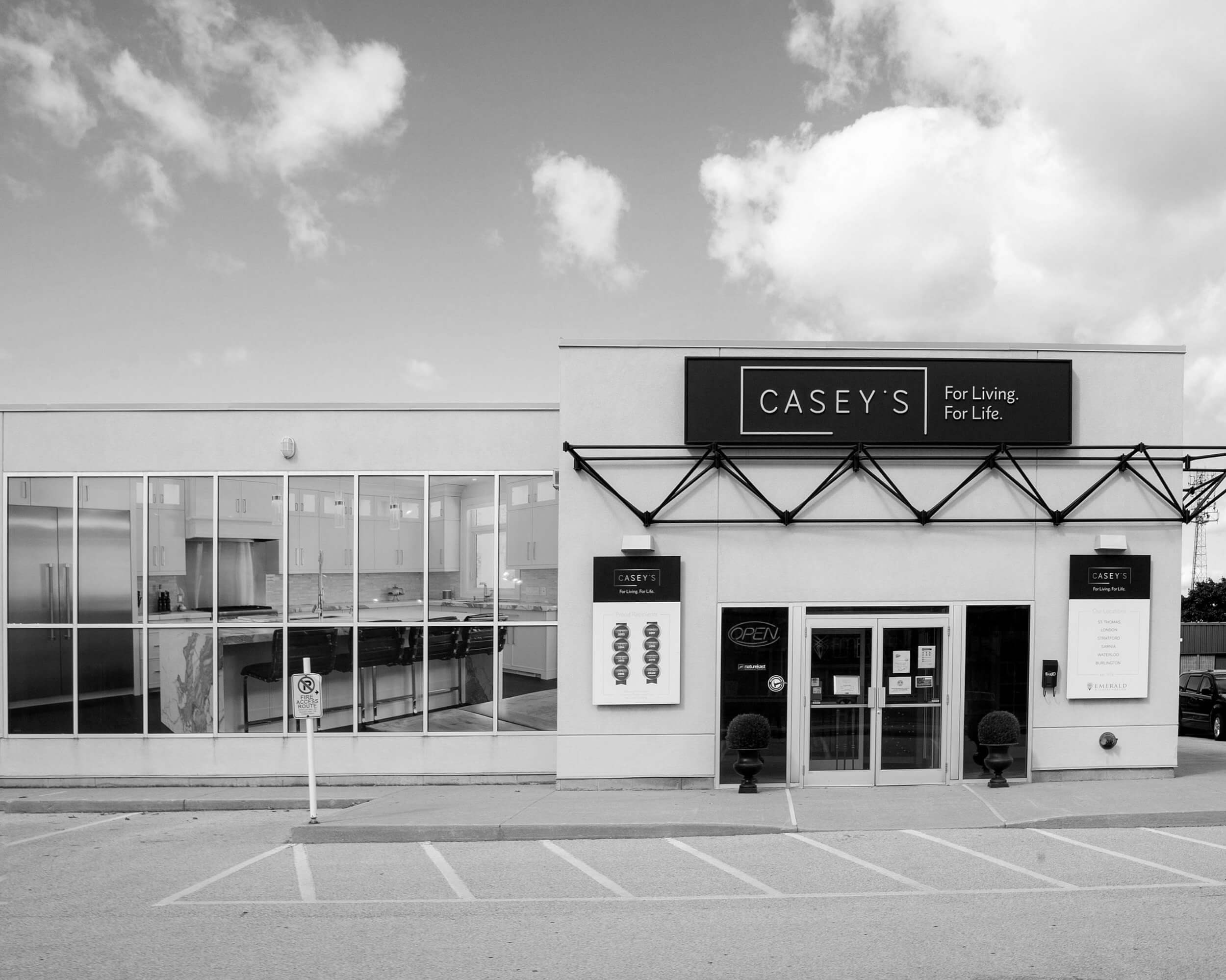 Exterior view of Casey's Kitchens building with large windows and signage displaying the brand name and slogan.